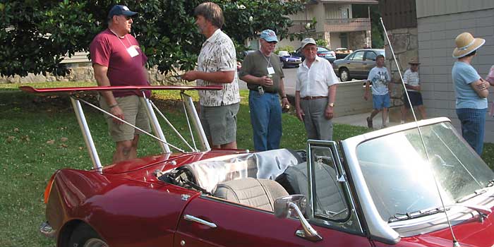 L-to-R Bill Guzman and Jim Blackwood discuss tuning, Jack Renaud and Ken Costello look on