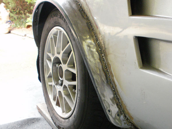 Nissan Stanza fender flare newly welded onto an MGB front fender.