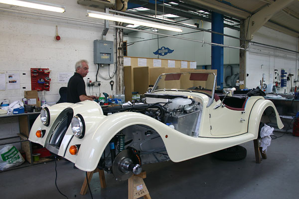 Morgan technicians use laptop computers to check and to program engine computers.