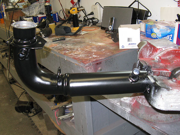 Modified Chevy pickup truck fuel filler neck.