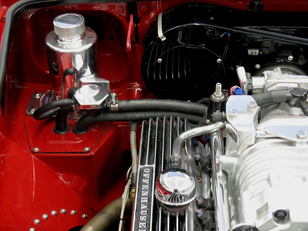 Handmade coolant header tank. Coolant fill and heater hoses to under-dash heater.