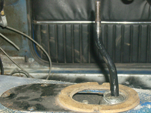 Cut-off Triumph TR7 shifter, with bent forward MGB lever welded on top.