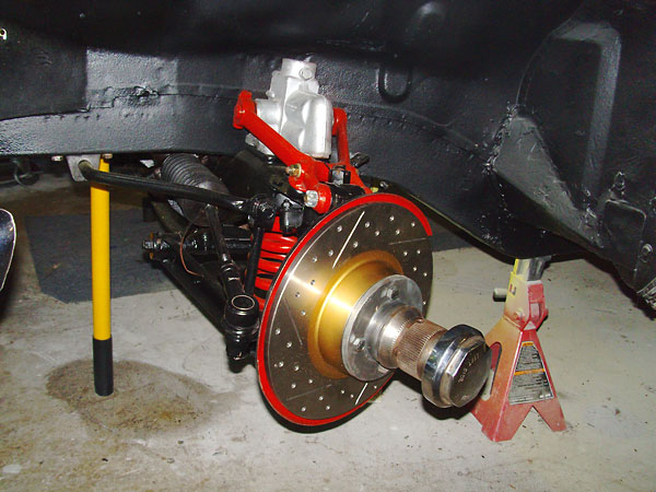 Stock MGB front suspension, with new EBC slotted and dimpled brake rotors.