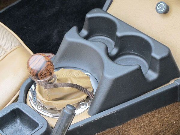 Zebrawood shifter knob and two-cup cupholder.