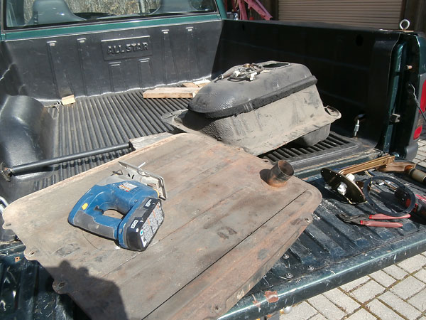 MGB fuel tank in foreground. Mazda Miata fuel tank in background.