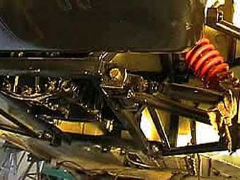 IRS with coil-over shocks, double wishbones, and CV joints.