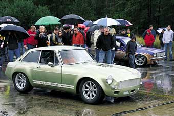 MGB GT racecar in the rain