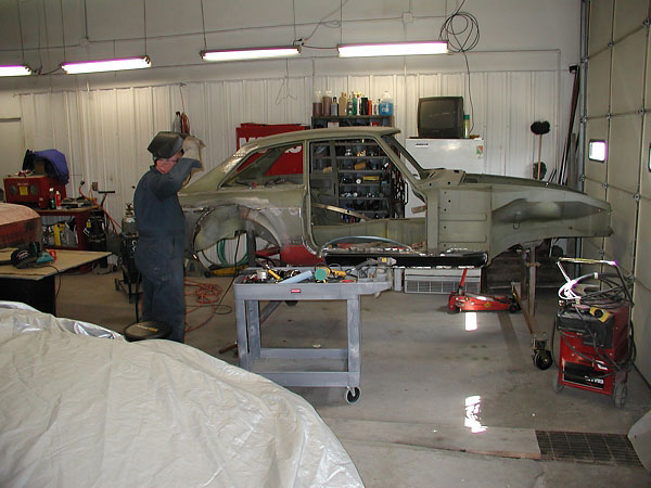 Preparing to install Dodge Omni fender flares.