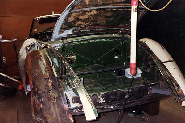 MGB bonnet modified to mate with the MGB trunk-lid hinges.