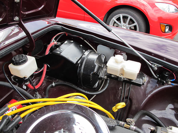 Late model MGB pedal assembly with power brake booster.