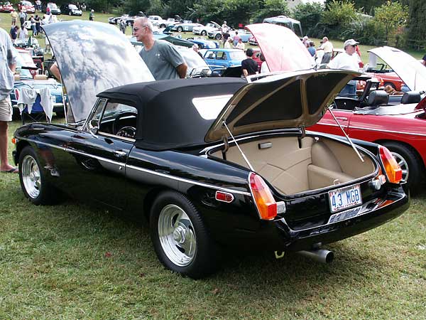 Custom Hartzcloth convertible top. Infinity Black urethane paint.