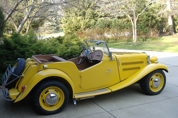 A GM space-saver spare, which fits front or rear, is mounted under the luggage rack in the traditional manner.