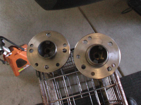 Hubs redrilled from GM's 5x4.75 lug pattern to MGB's standard 4x4.5 pattern.