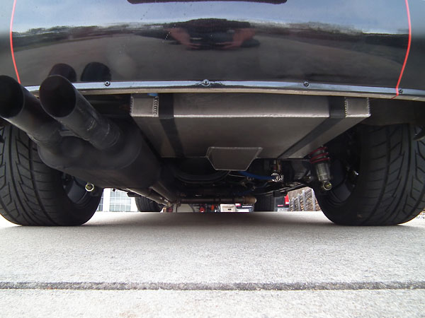 FlowMaster muffler and Summit Racing fuel cell viewed from below.