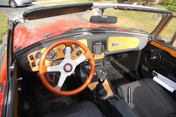 Custom dashboard with wood inserts.