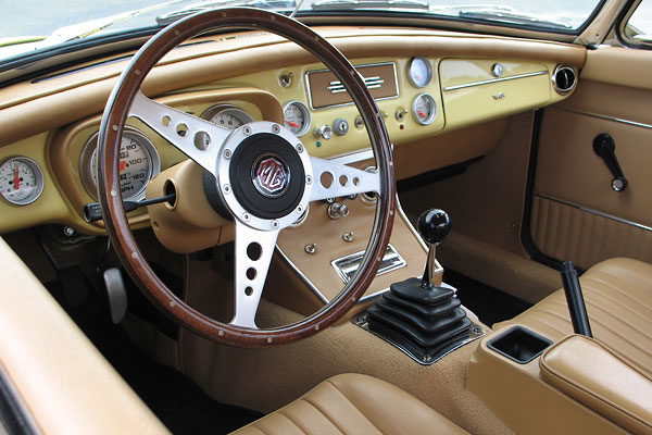 Tourist Trophy 15 inch wood three-spoke steering wheel.