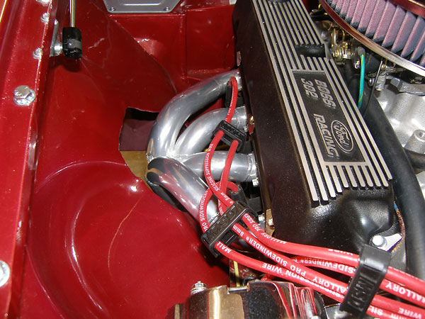 Mantell Motorsport RV8-style through the fender headers, ceramic coated.