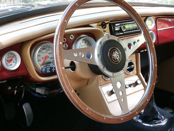 Wood trimmed steering wheel.