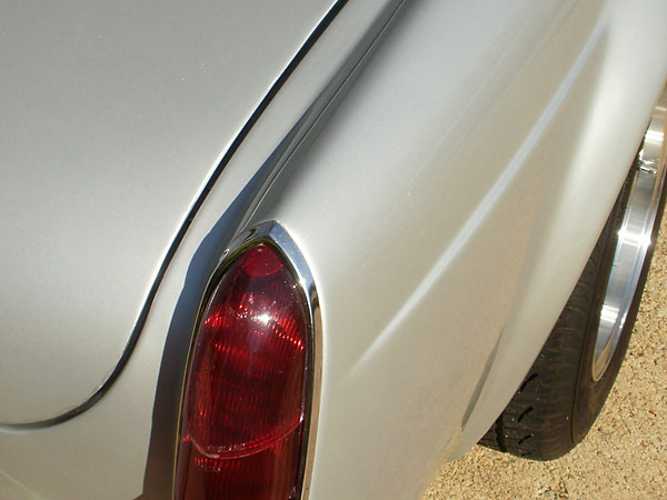 Fender seams removed. MGB MkI tail lamps installed.