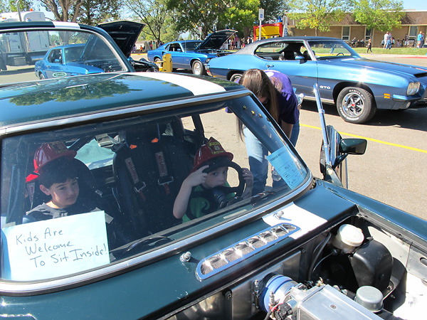 We enjoy welcoming kids to try on our seemingly kid-sized car.