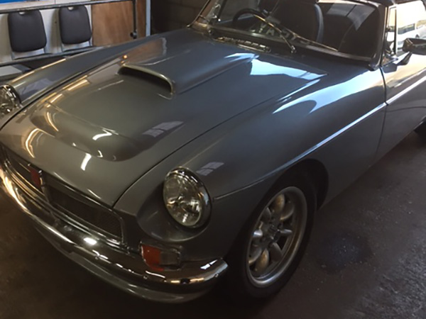 MGC style fiberglass bonnet, with hood scoop added.