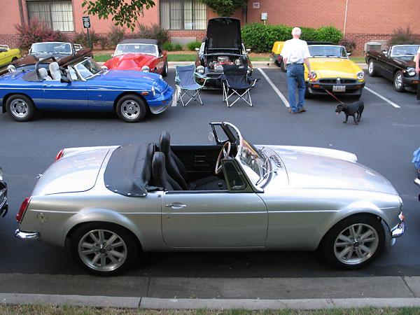 The convertible top folds down flat, and stows behind the seats under a zippered cover.