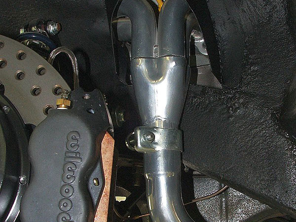 Stainless steel RV8-style exhaust headers.