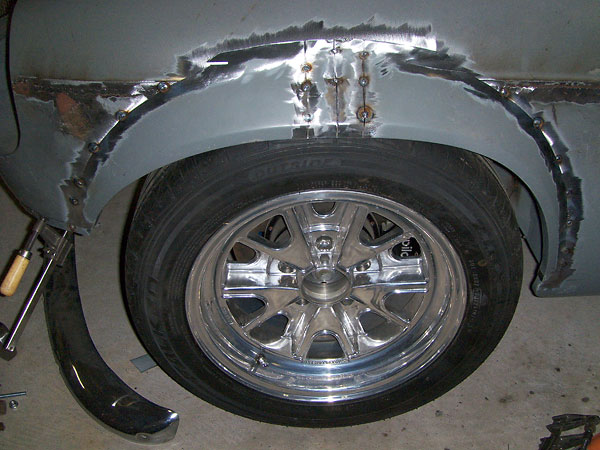 Installing a Dodge Omni fender flare (on MGB front/left).