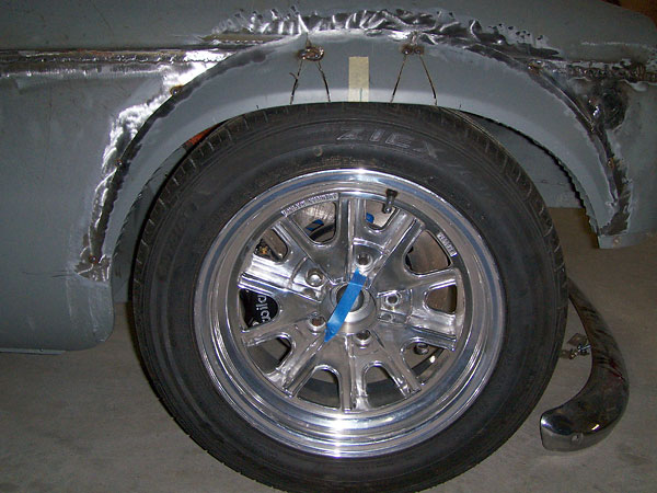 Installing a Dodge Omni fender flare (on MGB front/right).