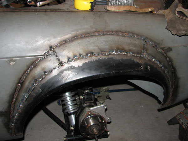 Dodge Omni fender flare on MGB: welding complete.