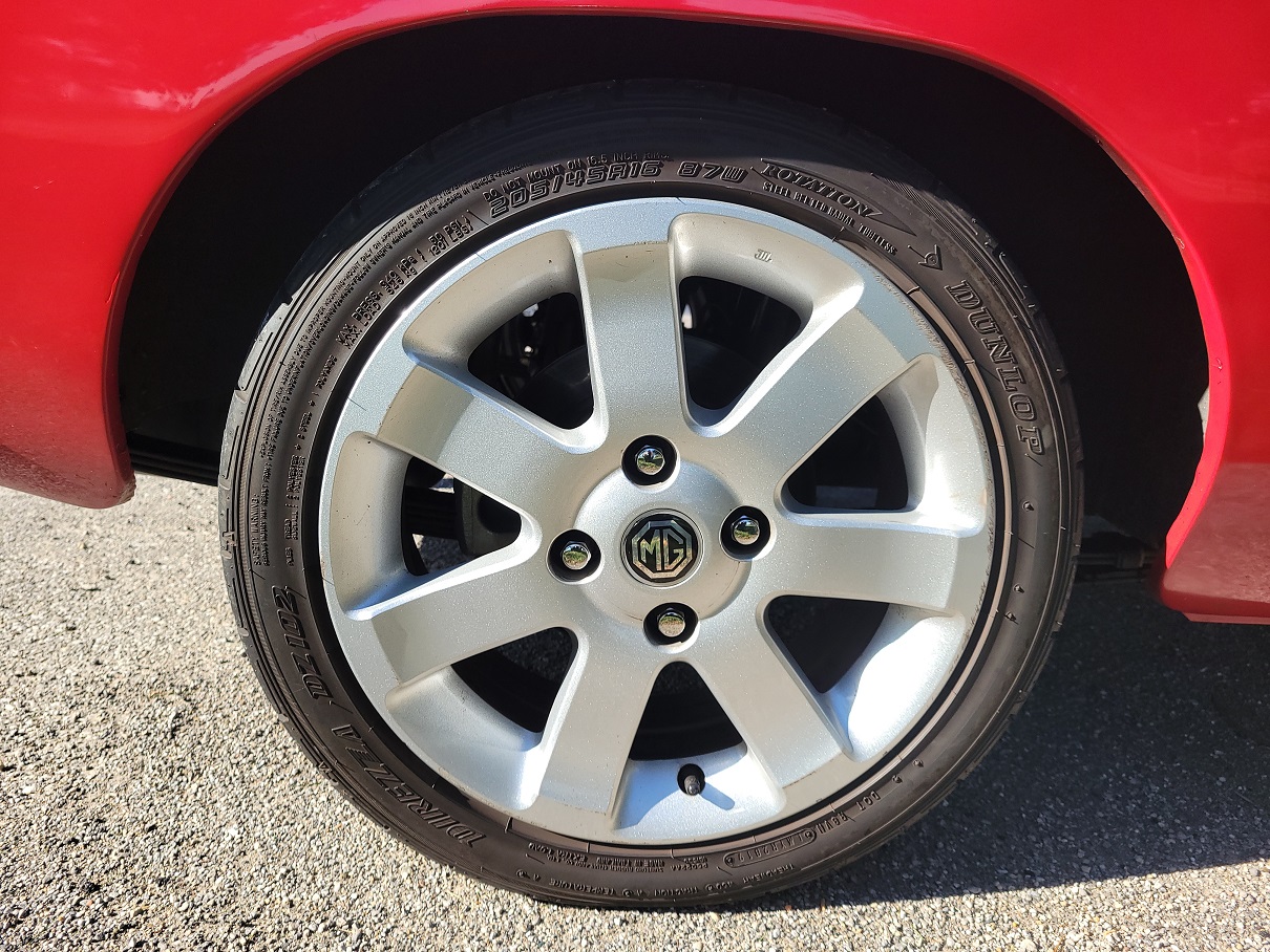 2010 Nissan Sentra alloy wheels, 205/45/16 Dunlop Direzza DZ102 tires.