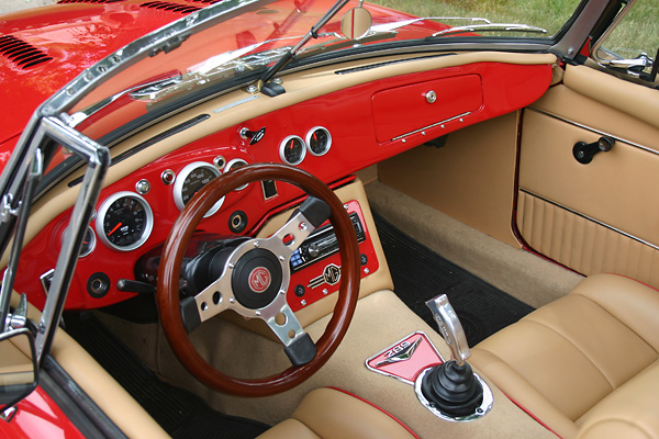 Scott relocated holes for the gauges, added a glove box, and created a fabric-covered eyebrow.