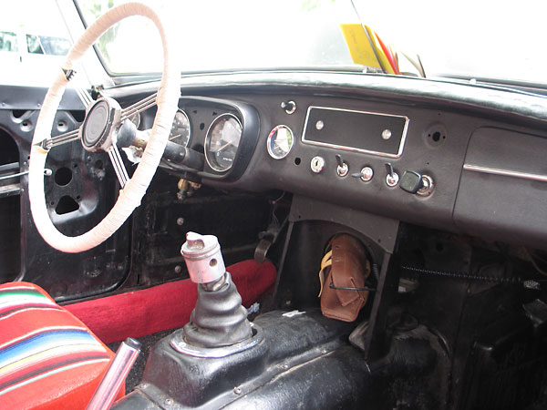 An old piston from a two-stroke outboard boat motor serves as a gear shifter knob.