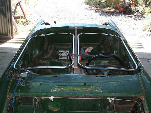 Steel conduit carefully bent to frame the cockpit openings.