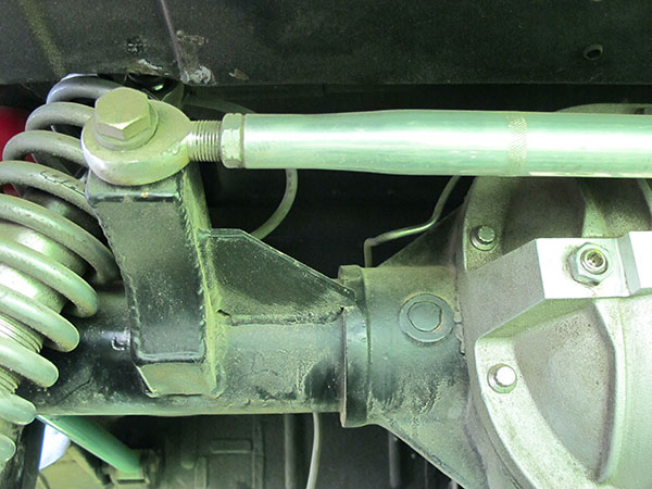 Panhard rod mount rearward of the rear axle.