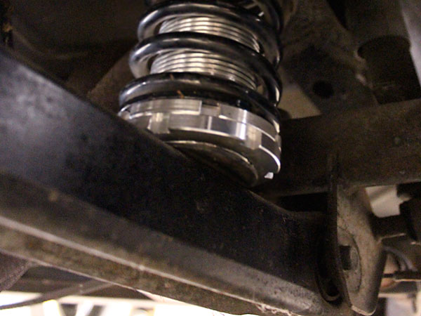 Jensen Healeys have large diameter rear springs mounted on simple non-adjustable perchs.