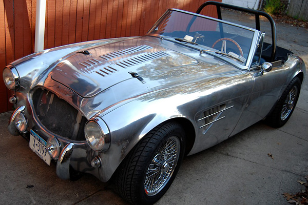 Louvered bonnet. Rally-style side vents. Custom fender flares.