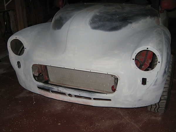 Fenders, hood, and front welded together to make a one piece front clip.