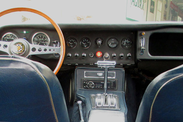 Stewart Warner speedometer, tachometer, and small gauges.