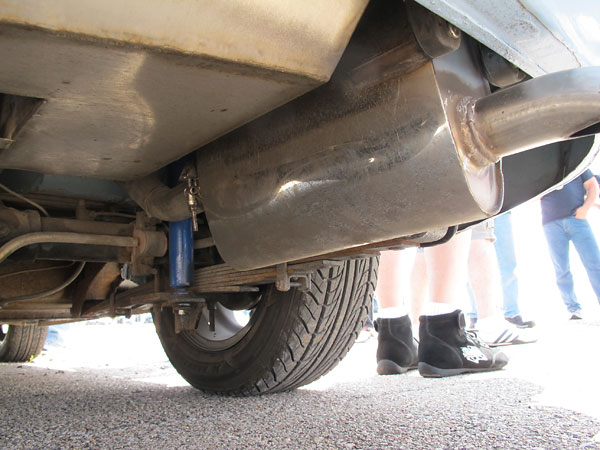 Stock leaf springs. Custom anti-sway bar. Tube shocks of unknown specification.