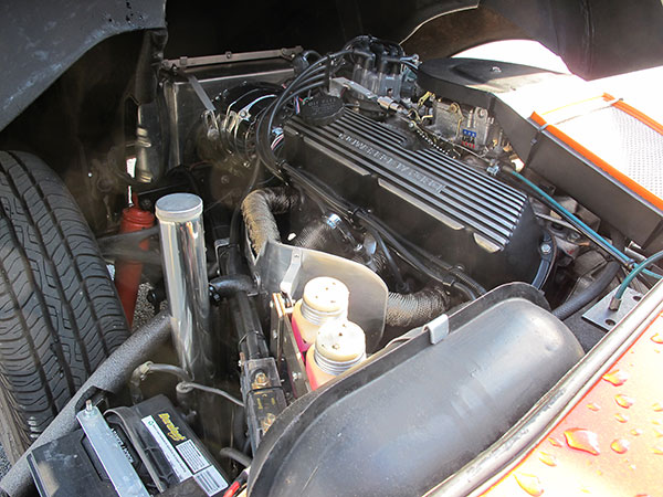 Tim fabricated new alternator and AC compressor brackets, a fan shroud, and a custom air cleaner.