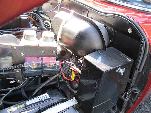 Air reservoir for electronically controlled, pneumatically actuated cruise control system.