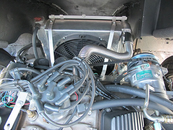 Aluminum radiator and custom fabricated fan shroud.