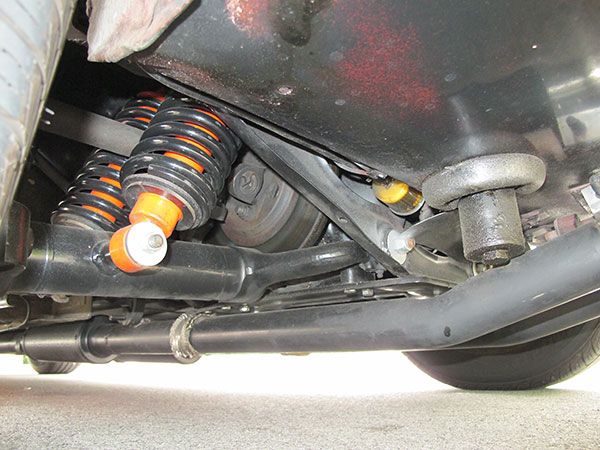 Stock Jaguar rear suspension. Note inboard disc brakes.