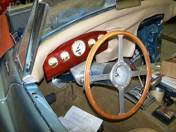 new Rosewood instrument panel with smaller speedometer hole