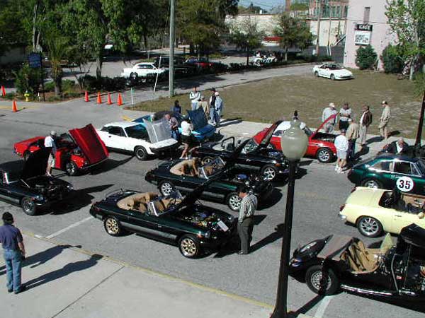 Michael Perkins' Triumph TR8 coupe (white) and Rick James' TR7/8 (metallic blue) (Driven by Tim and Tina Lanocha)