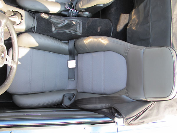 Early Mazda Miata seats with upgraded speakers in headrests.