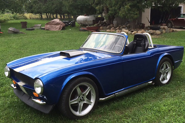 Shaker-style hood scoop. Door handles, locks, and side marker lamps shaved.