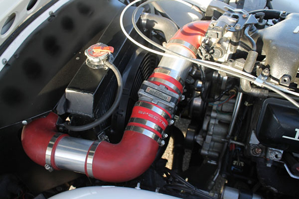 Cold air intake hose routing, and mass airflow sensor installation.