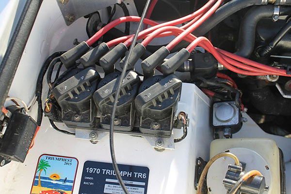 Three dual-tower ignition coils installed atop a GM Ignition Control Module.